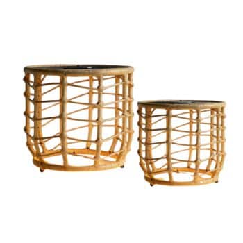 Two round rattan side tables with open, woven bases and flat, dark tops. One table is larger than the other, and both feature a natural, light brown finish—perfect complements for your outdoor tables and chairs ensemble.