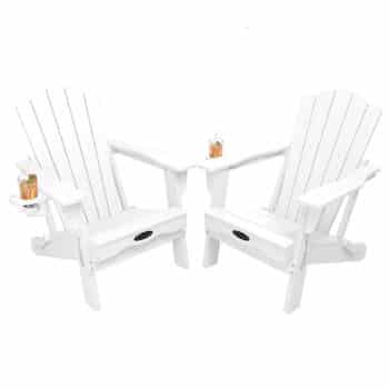 Two white Adirondack chairs connected by a small center table form a stylish set of outdoor tables and chairs, each featuring a drink holder with a beverage glass. The arrangement sits on a plain white background.