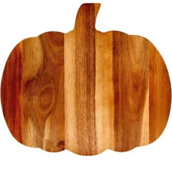 A wooden cutting board shaped like a pumpkin, featuring natural wood grain patterns and varying shades of brown—perfect for prepping easy fall dinners.