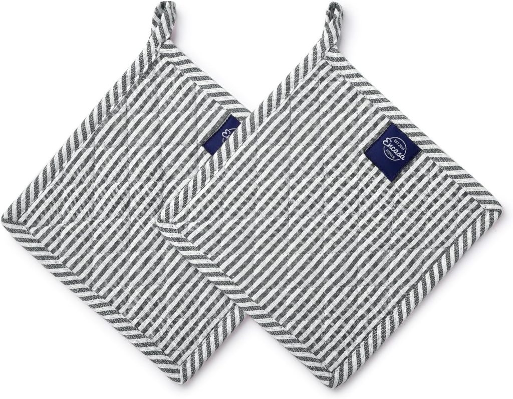 Two gray and white striped square pot holders with corner loops and dark blue labels, arranged overlapping on a white background—perfect kitchen essentials for when you’re cooking up a flying dutchman burger recipe.
