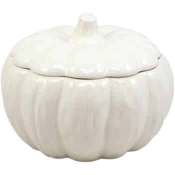 A white ceramic container shaped like a pumpkin with a lid and short stem on top, perfect for serving my favorite Thanksgiving recipes.
