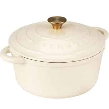 A cream-colored, round cast iron Dutch oven with a gold knob on the lid and integrated side handles—perfect for preparing my favorite Thanksgiving recipes. The word "OVERMONT" is embossed on the lid.