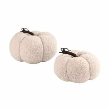 Two plush, cream-colored decorative pumpkins with dark brown stems, featuring a soft, textured, fleece-like fabric, placed side by side on a white background.
