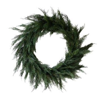 A simple, circular wreath made of green pine branches with a natural, slightly uneven shape, displayed on a white background.