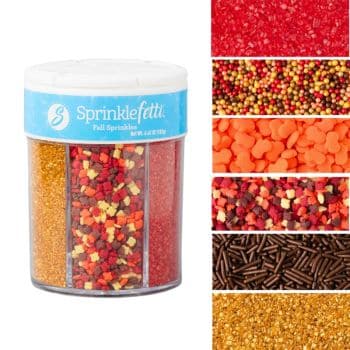A clear container labeled "Sprinklefetti Fall Sprinkles" displays five sections of colorful fall-themed sprinkles—perfect for decorating Thanksgiving treats—with close-up views of red, orange, gold, brown, and multicolored shapes on the right.