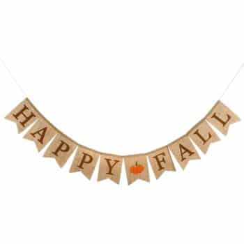 A burlap banner, perfect for wall crafts for fall, hangs with triangular flags spelling "HAPPY FALL" in brown letters, featuring a small orange pumpkin in place of the "A" in "FALL.
