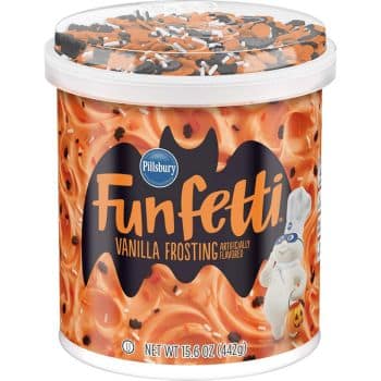 A tub of Pillsbury Funfetti Vanilla Frosting with orange frosting, Halloween-themed sprinkles, and the Pillsbury Doughboy holding a pumpkin on the label—perfect for festive Thanksgiving treats. The background features bats and festive designs.