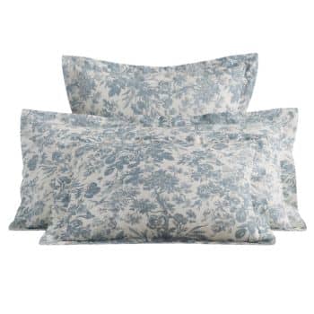 Three pillows with a blue and white floral pattern are stacked against each other. The design features intricate, delicate flowers and leaves, giving the pillows a classic and elegant look.