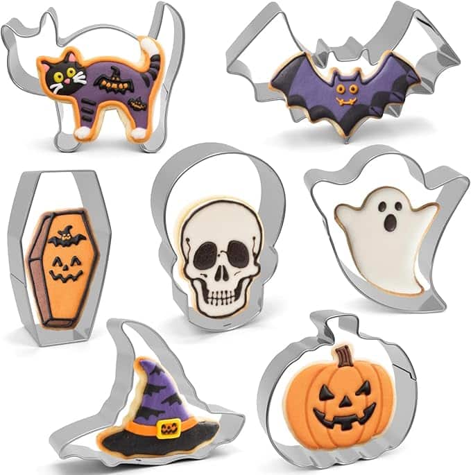 Seven Halloween-themed cookies and their matching metal cookie cutters—black cat, bat, coffin, skull, ghost, witch hat, and jack-o’-lantern pumpkin—make the perfect halloween treats, all decorated in festive colors.
