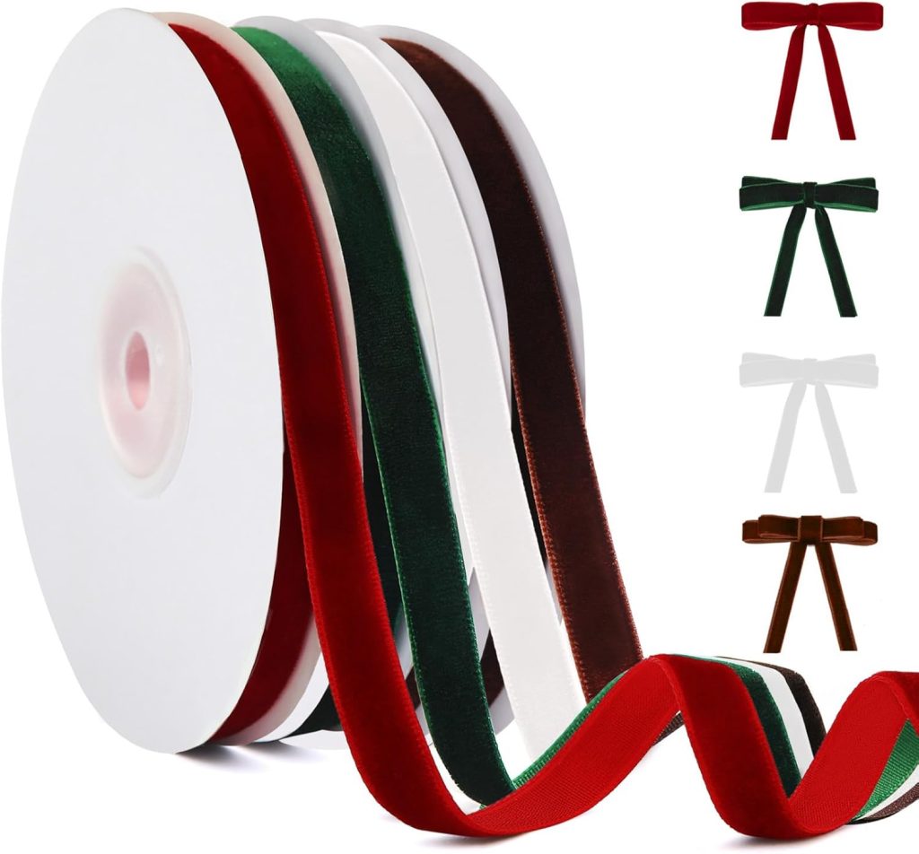 Three large spools of velvet ribbon in red, green, and brown colors, with loose ribbon trailing in front—perfect for crafting DIY Christmas ornaments. On the right, small bows are displayed in matching festive colors.