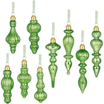 Nine green glass Christmas ornaments with gold tops and white hanging ribbons, each ornament featuring a different elongated and intricate shape, arranged in three rows on a white background.