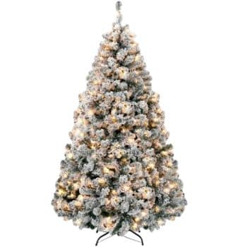 A full artificial Christmas tree with snow-frosted branches and warm white lights, standing on a black metal stand against a plain background.