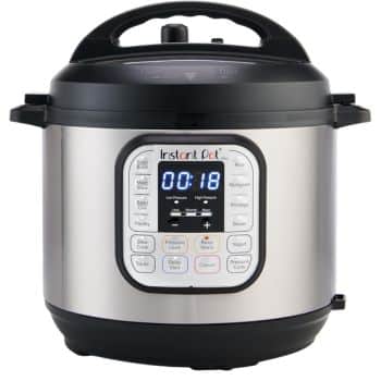 A stainless steel Instant Pot electric pressure cooker with a digital display showing 18 minutes and various cooking function buttons on the front panel, perfect for preparing delicious Thanksgiving food with ease.