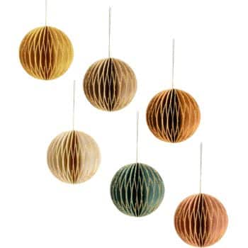 Six round, honeycomb paper ornaments in shades of gold, brown, green, and copper, each hanging from a thin string against a white background.