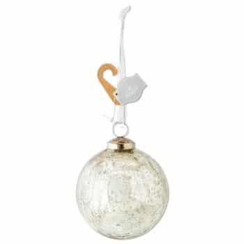 A round, silver glass Christmas ornament with a textured, reflective surface hangs from a white ribbon with a tan hook and a white tag attached.