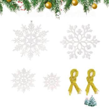 Four white snowflake ornaments and two gold hanging cords are displayed on a white background with a festive pine and ornament border at the top and two small Christmas tree icons at the bottom right.