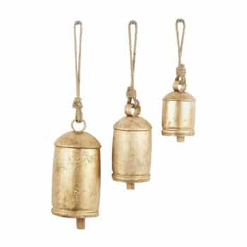 Three golden metal bells of varying sizes hang from rustic rope loops against a plain white background—my favorite Christmas decor for adding timeless charm and festive spirit.