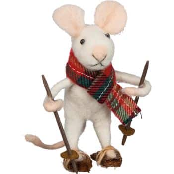A white toy mouse wearing a red and green plaid scarf stands upright, holding two ski poles and wearing small skis on its feet—my favorite Christmas decor for adding whimsical charm to any holiday display.