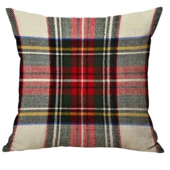 Square throw pillow with a red, black, green, yellow, and white plaid tartan pattern. The bold design features intersecting lines and checks, giving the pillow a classic, cozy appearance.