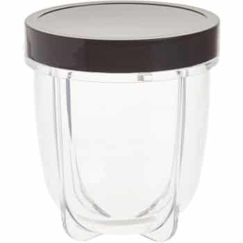 A clear plastic blender cup with a dark-colored screw-on lid, shown against a white background.