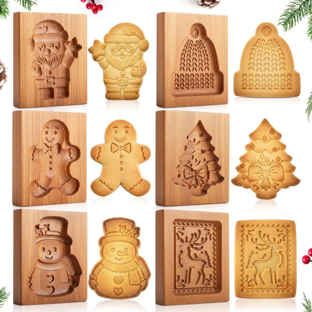 Wooden molds and matching molded cookies in festive shapes—Santa, hat, gingerbread person, Christmas tree, snowman, and reindeer—arranged in a grid with holiday decorations, perfect for trying a classic Molded Cookies Recipe.