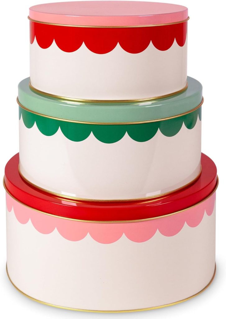 Three round, stacked tins with scalloped patterns in red, green, pink, and mint colors. Each tin has a gold rim and lid, perfect for storing your favorite molded cookies or sharing a beloved molded cookies recipe.