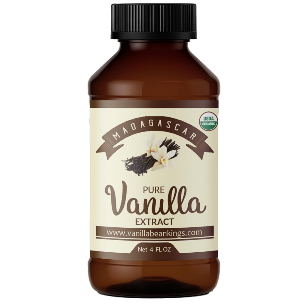 A brown bottle labeled “Madagascar Pure Vanilla Extract” with an image of vanilla flowers and beans, a USDA Organic seal, and www.vanillabeankings.com. Perfect for any Cookie Recipe. Size indicated as 4 fl oz.