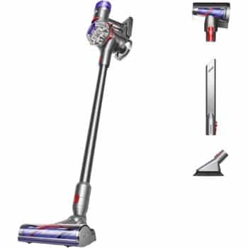 A cordless stick vacuum cleaner with a long handle and detachable attachments, including a motorized brush head, a crevice tool, and a small cleaning nozzle, shown on a white background.