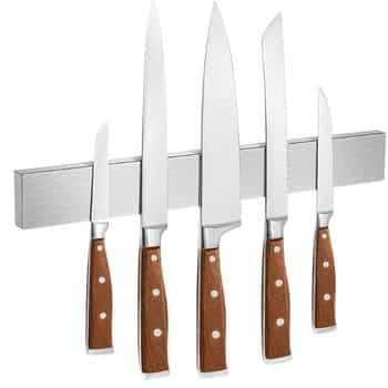 Five kitchen knives with brown handles are attached to a magnetic stainless steel strip, displayed upright in a row against a white background.