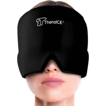 A person wears a large black TheraICE face mask that covers their eyes, forehead, and upper cheeks, designed for therapeutic cooling or compression. Only the lower part of their face is visible.