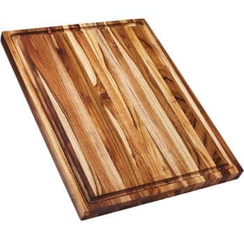 Rectangular wooden cutting board with a striped pattern of light and dark wood grains, featuring a shallow groove around the edge for catching liquids.