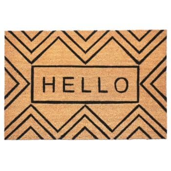 Rectangular doormat with a tan background, black geometric border pattern, and the word "HELLO" in bold black capital letters in the center.