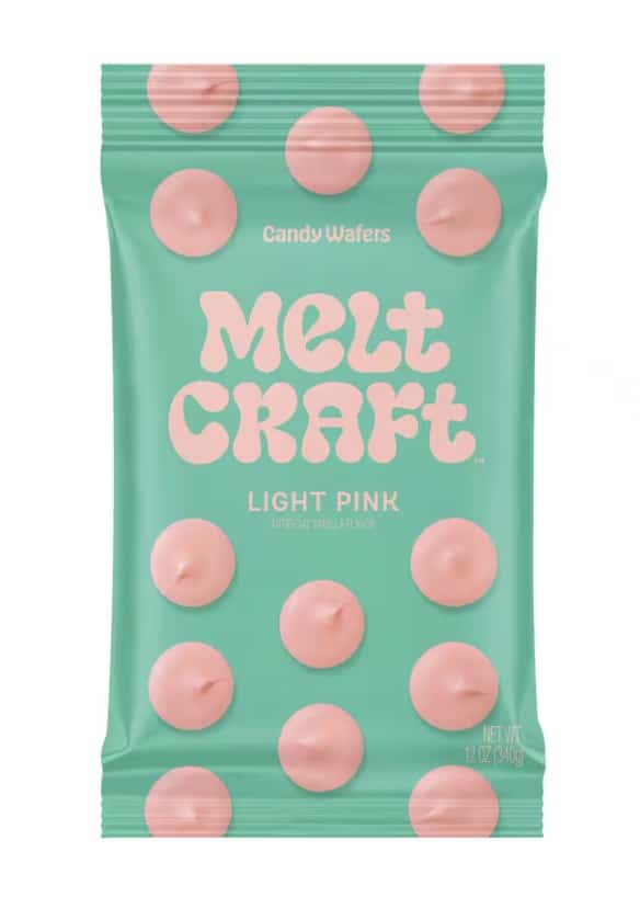 A teal package labeled "Melt Craft Light Pink" with pink candy wafers and playful bubble lettering—great for your heart shaped brownies recipe. The front features "Candy Wafers," "Artificial Vanilla Flavor," and images of pink wafers.
