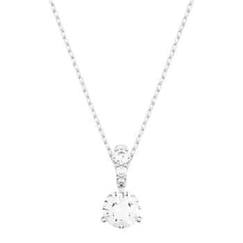 A delicate silver necklace with a fine chain featuring a single round-cut, sparkling diamond pendant in a simple prong setting.