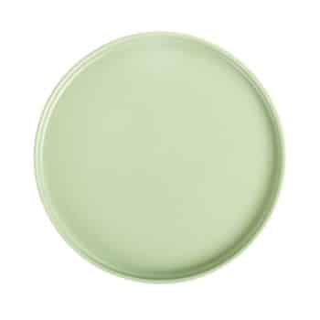 A round, light green plate with a smooth surface and slightly raised edge, viewed from above on a plain white background.