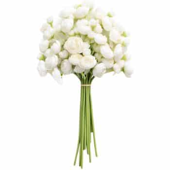 A bouquet of white artificial flowers with round petals and long green stems, tied together with a beige band.
