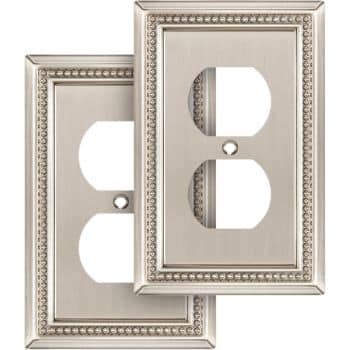 Two decorative metal outlet covers with a brushed nickel finish and a beaded border design, each featuring two openings for electrical outlets.