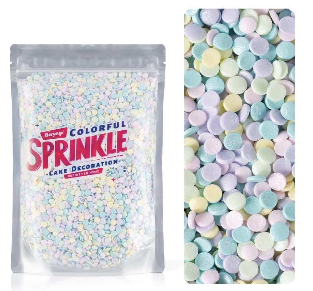 A clear bag labeled "Colorful Sprinkle Cake Decoration" filled with small, round pastel sprinkles—perfect for topping your next meringue cookies recipe; close-up of sprinkles shown beside the bag in blue, yellow, pink, green, and purple.