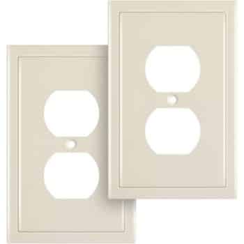 Two beige electrical outlet covers with two round openings each, designed to fit standard wall sockets. One cover is slightly overlapping the other.