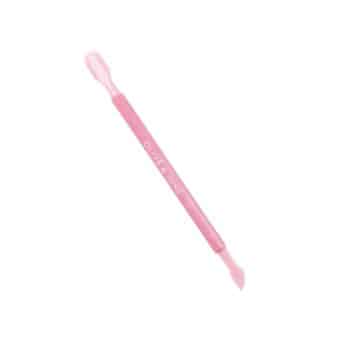 A double-ended pink silicone tool with a flat, rounded tip on one end and a tapered, angled tip on the other, used for beauty or nail care.