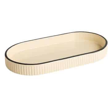 A cream-colored, oval-shaped tray with ridged sides and a thin black rim around the top edge, viewed from a slight angle.