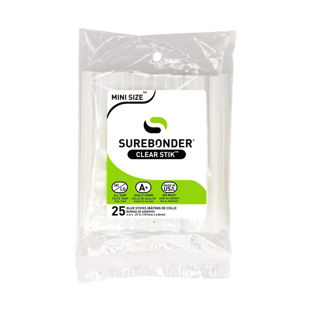 A clear plastic package of Surebonder Clear Stik mini-size glue sticks, perfect for crafting projects like a spring flower wreath. The front label states 25 glue sticks, high and low temperature use, with quality and USA-made icons.