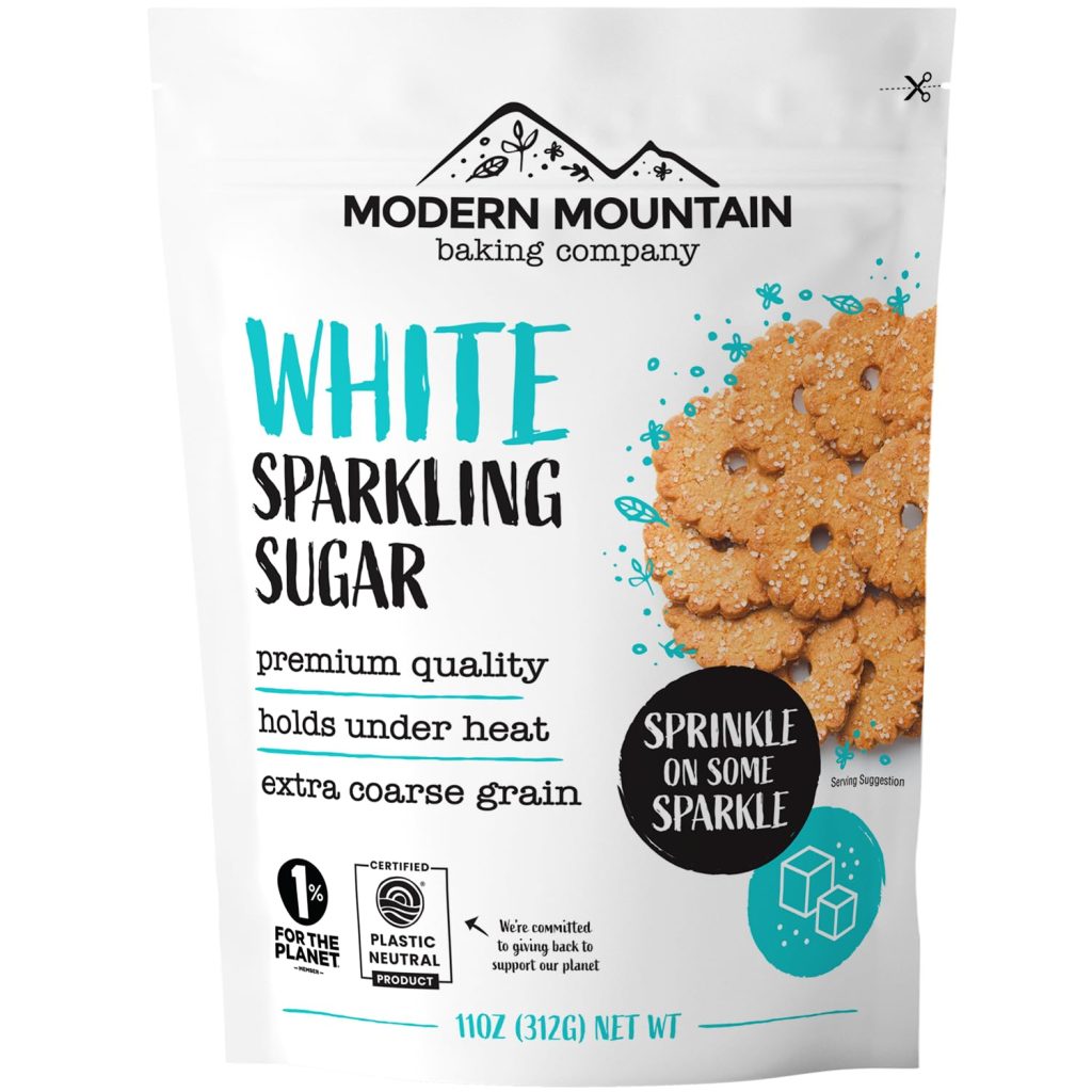A package of Modern Mountain Baking Company White Sparkling Sugar features cookies on the right, text highlighting its premium quality, heat resistance, extra coarse grain, 11oz (312g) net weight—perfect for your next Irish Soda Bread Recipe.