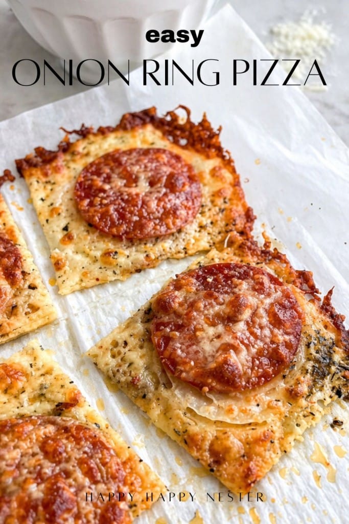 A rectangular onion ring pizza recipe topped with cheese, herbs, and round onion and pepperoni slices, cut into squares and served on parchment paper. Text reads "Easy Onion Ring Pizza.