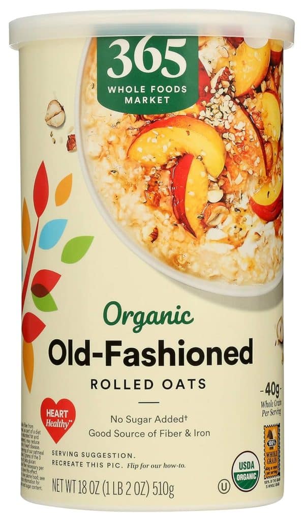 A container of 365 Whole Foods Market Organic Old-Fashioned Rolled Oats, featuring an image of oatmeal with fruit and nuts. The label highlights fiber and iron content—perfect for your favorite overnight oats recipe.