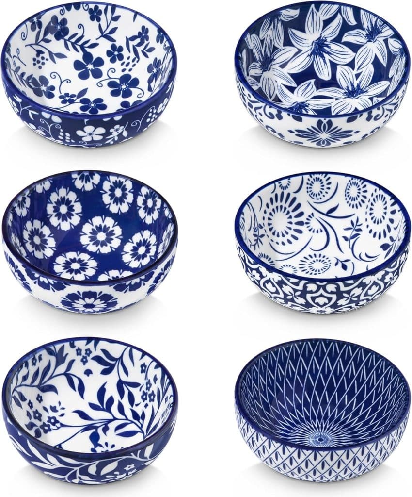 Six ceramic bowls with various intricate blue and white floral and geometric patterns, perfect for serving your favorite sides or showcasing a delicious fried wonton recipe, arranged in two rows on a white background.