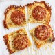 Four square slices of crispy cheese bread topped with pepperoni and grated cheese, arranged on parchment paper with browned, bubbly edges&mdash;perfect as a savory side for your favorite onion ring pizza recipe.