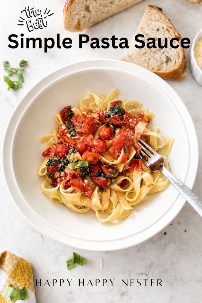 A white bowl of fettuccine topped with a simple pasta sauce recipe, spinach, and grated cheese sits on a light surface with a fork, bread slices, and basil leaves nearby. Text reads "Simple Pasta Sauce.