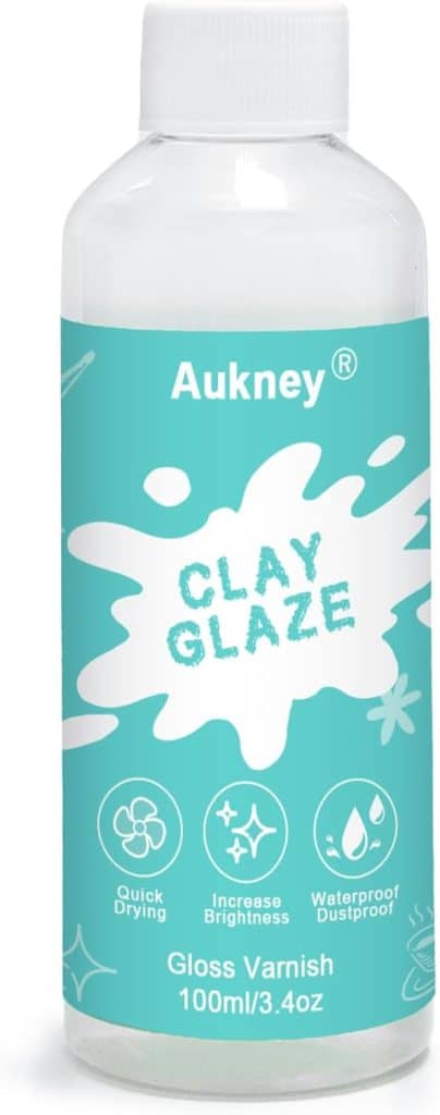 A bottle of Aukney Clay Glaze Gloss Varnish, 100ml/3.4oz, with a blue label featuring white icons for quick drying, increased brightness, and waterproof dustproof properties—ideal for your oyster shell wreath DIY projects.
