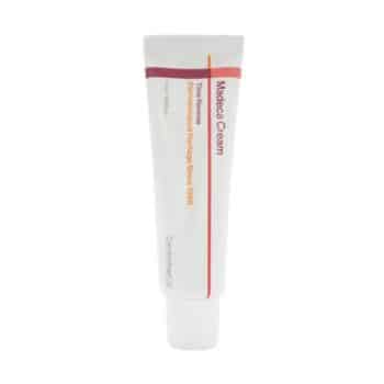 A white tube labeled “Madeca Cream” with red and orange accents and text, standing upright on a white background.